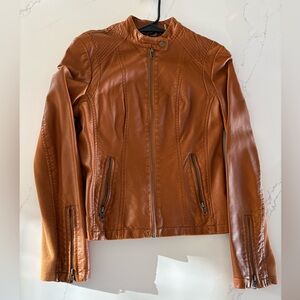 Black rivet xs(I’d say runs more like a small) leather (fake) jacket